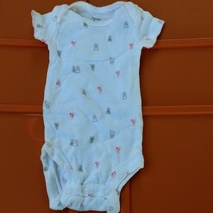 Precious Firsts size newborn onesie.